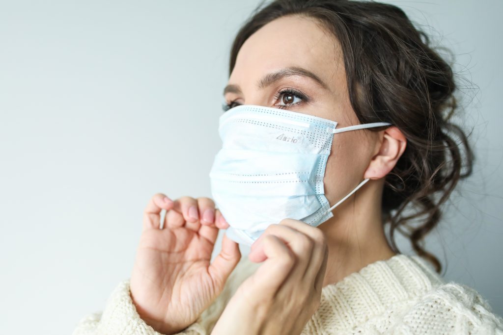 woman in white face mask 3873193