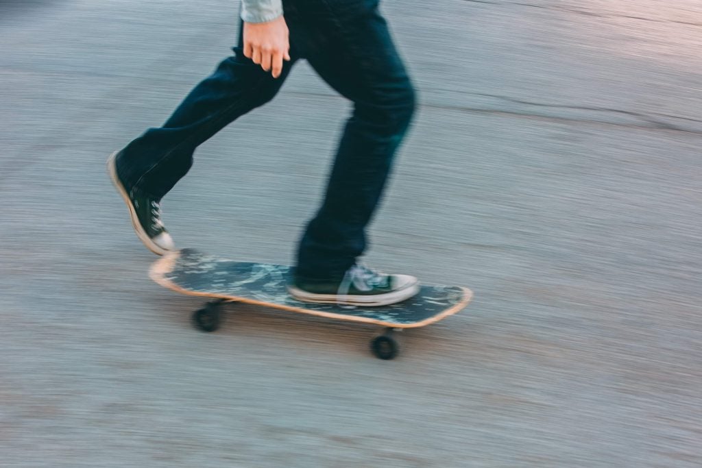 The guy riding his skateboard on the street | McLeish Orlando Personal Injury Lawyer Toronto