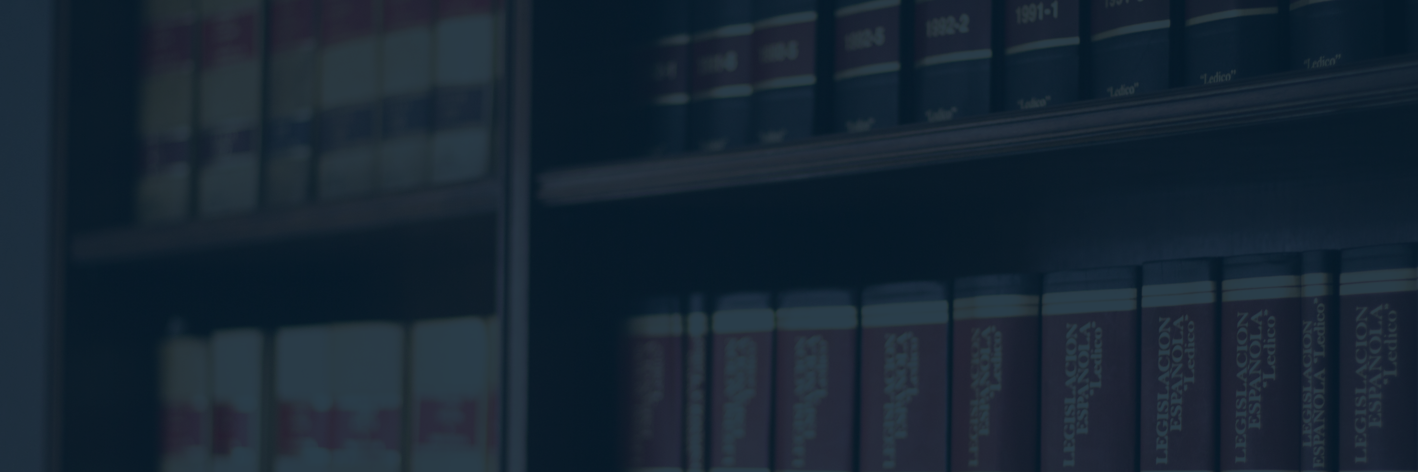 Blurred shelves of legal reference books symbolizing Licence Appeal Tribunal decision on catastrophic impairment under Criterion 8